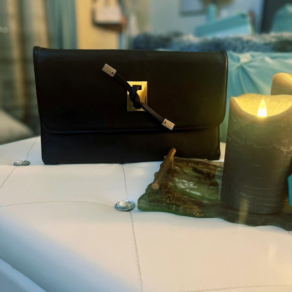 flat large black clutch with gold buckle - tied leatherstrap around front buckle